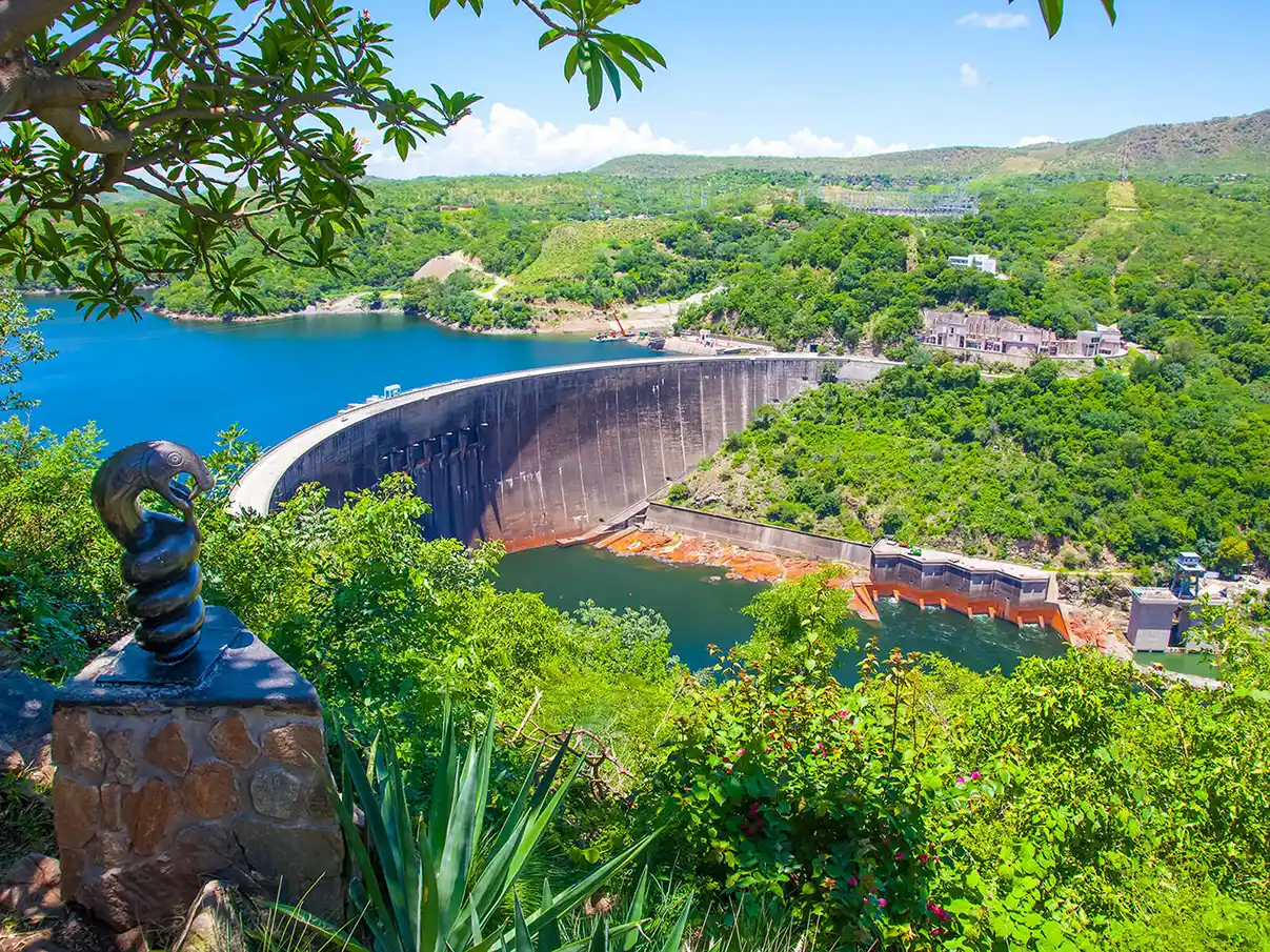 Kariba Dam, a massive hydroelectric power station on the Zambezi River, creating Lake Kariba, one of the largest artificial lakes in the world. Discover the beauty and significance of this engineering marvel with Africa for You Safaris, a leading ground handling agent based in Victoria Falls and Bulawayo