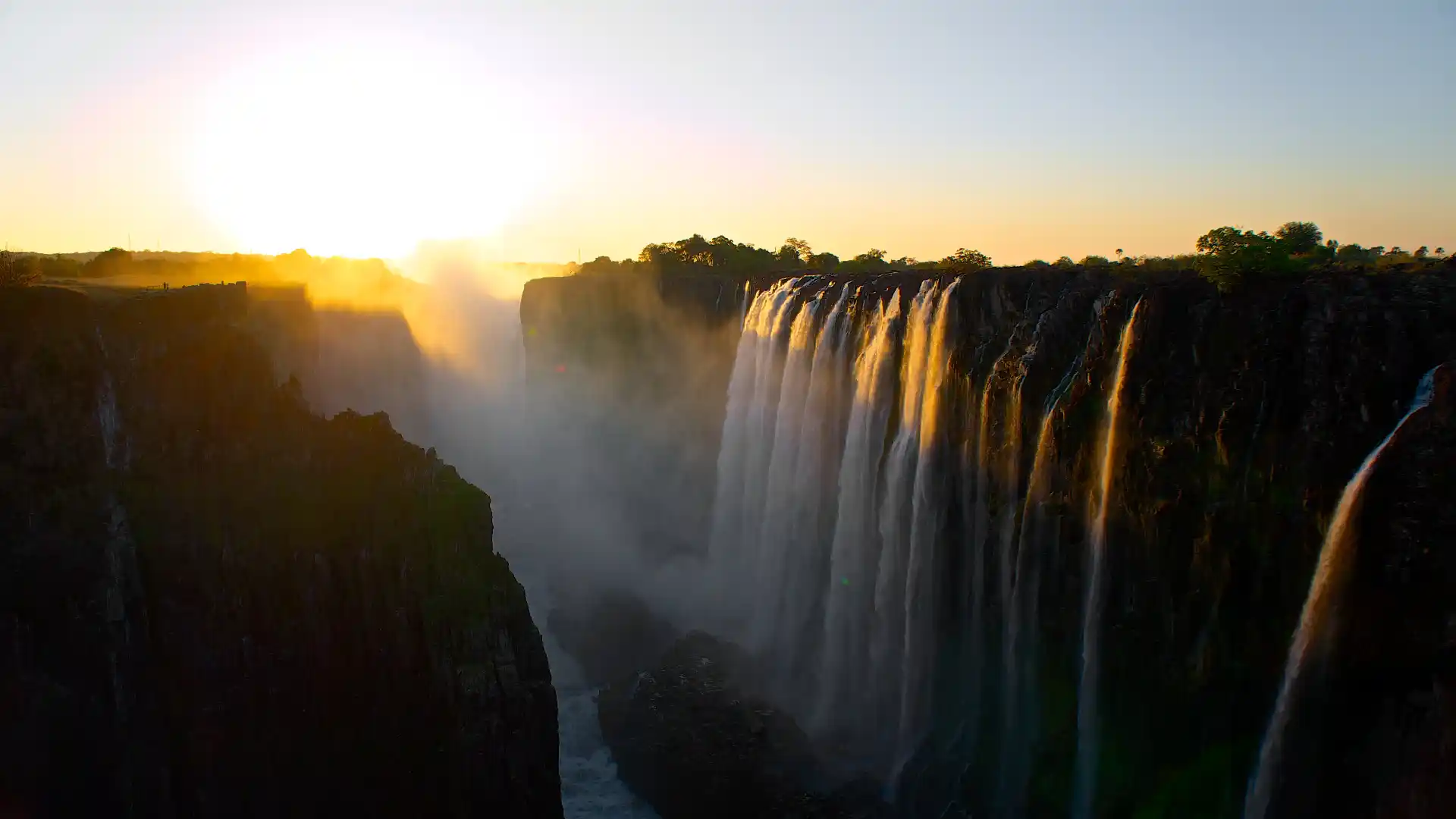 Victoria Falls, one of the Seven Natural Wonders of the World, cascading over the Zambezi River in Zimbabwe and Zambia. Experience the breathtaking beauty and power of this iconic waterfall with Africa for You Safaris, a leading ground handling agent based in Victoria Falls and Bulawayo